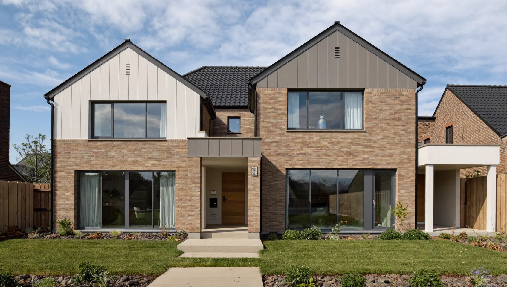 Modern brick and timber-clad detached house with large windows and a landscaped front lawn