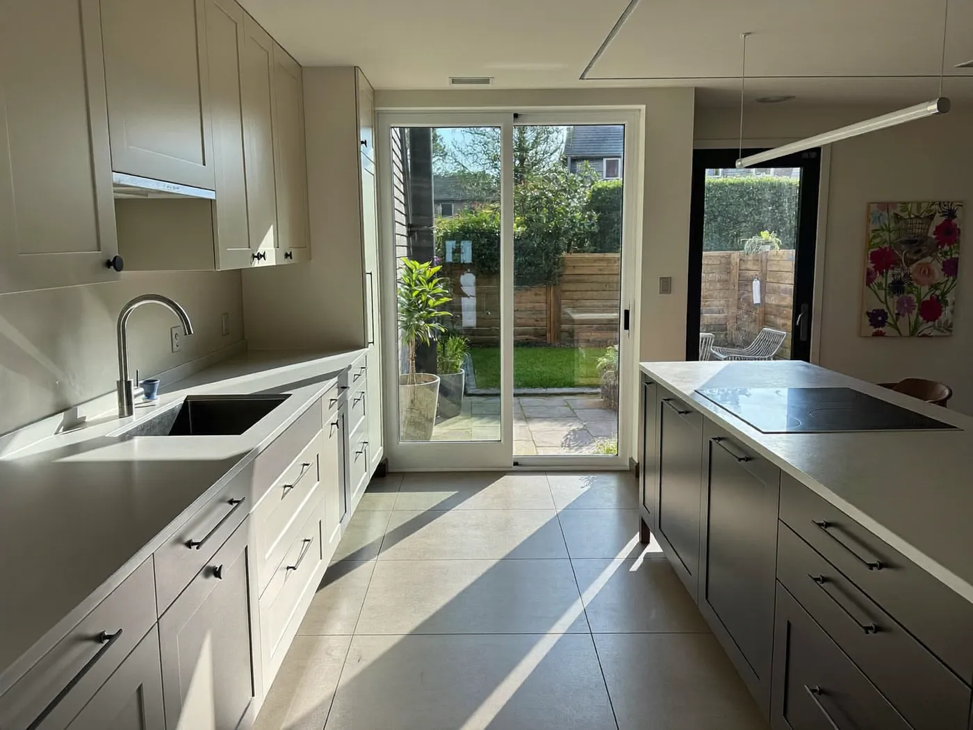 Barking & Dagenham: family kitchen in a new rear extension with sliding doors to the garden
