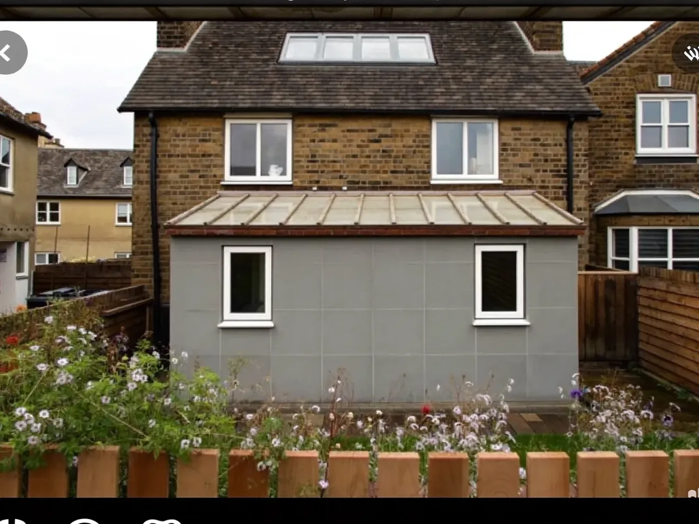 Barnet: grey-clad box dormer loft conversion on the rear roof of a house with white windows