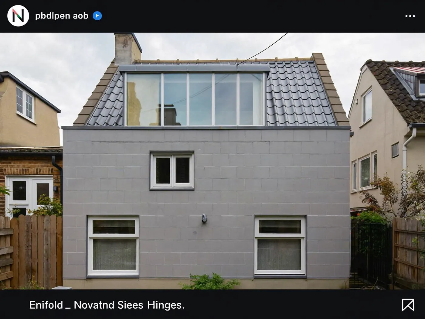 Enfield: grey-clad box dormer loft conversion on the rear roof of a house with white windows