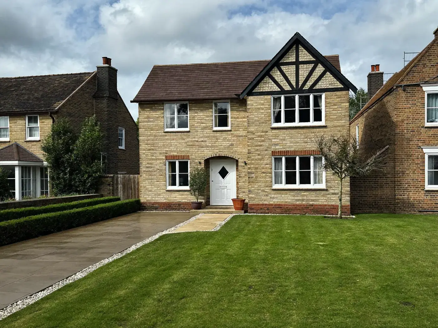 Gerrards Cross: newly built brick detached family house with a tiled roof and driveway