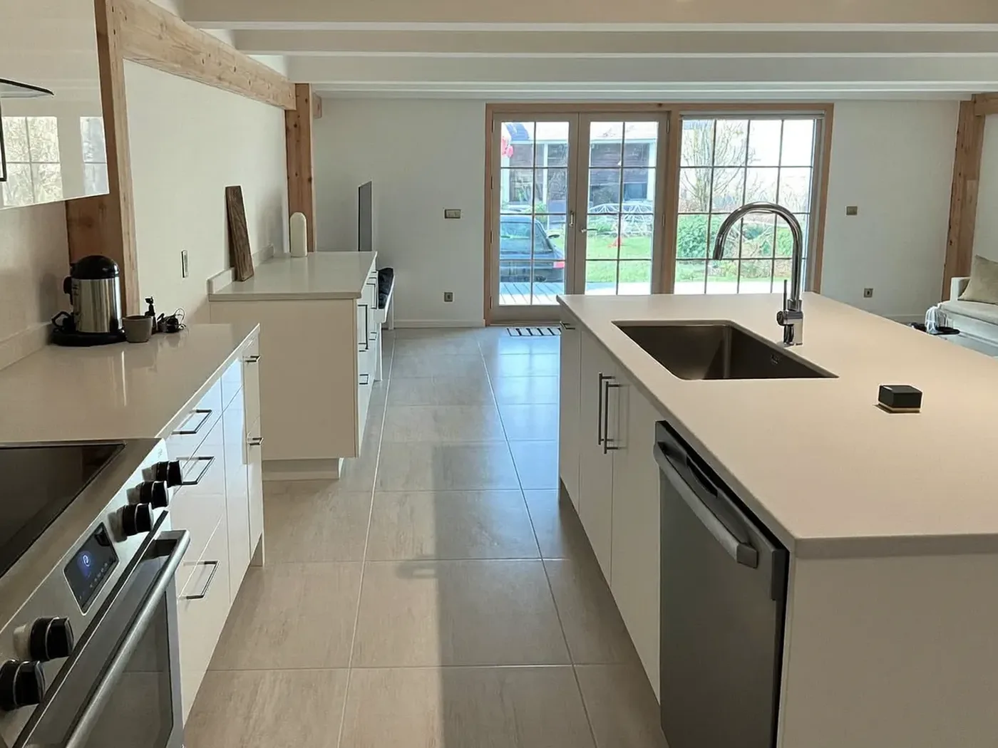 Haringey: family kitchen in a new rear extension with sliding doors to the garden