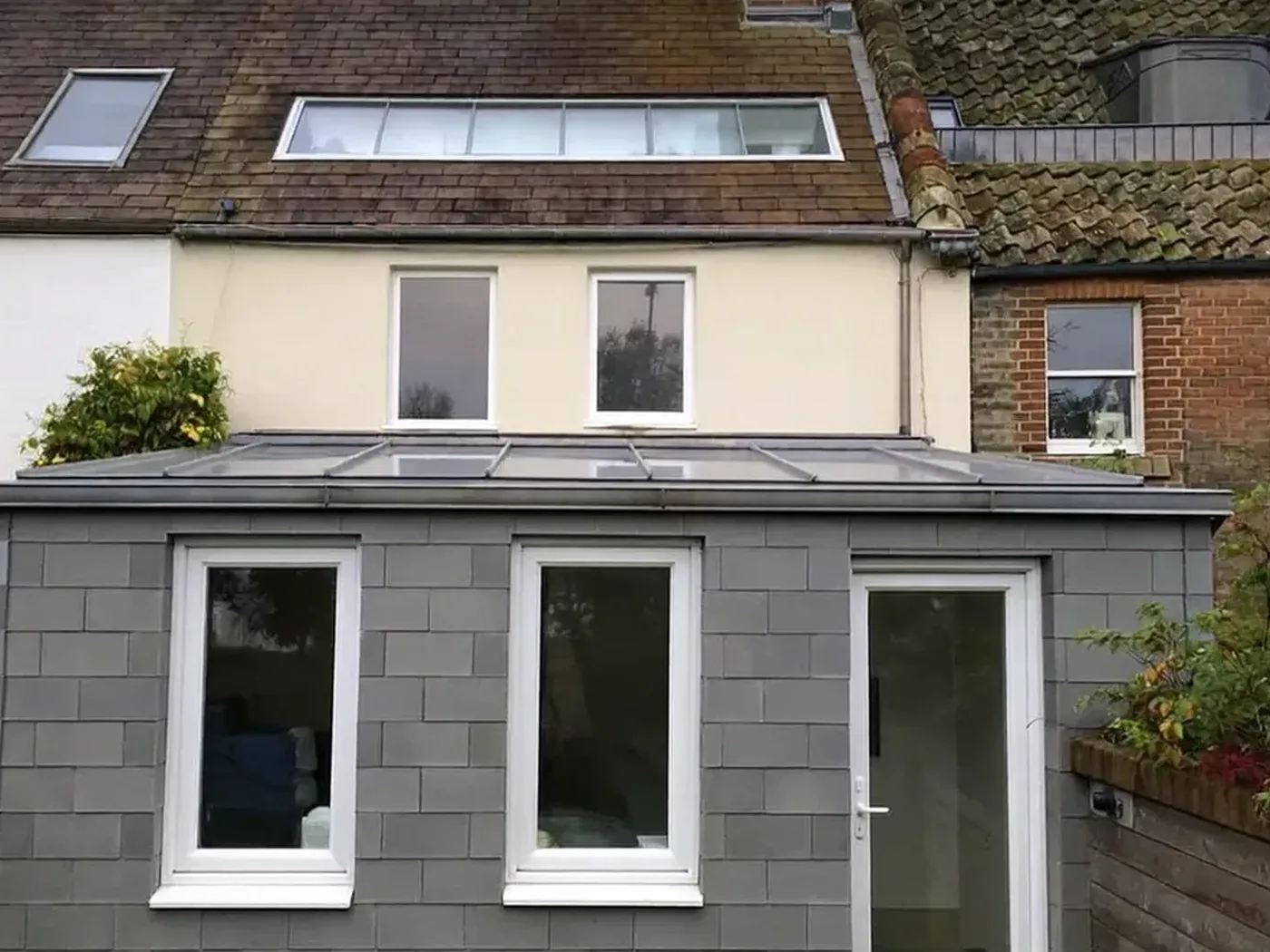 Hemel Hempstead: grey-clad box dormer loft conversion on the rear roof of a house with white windows