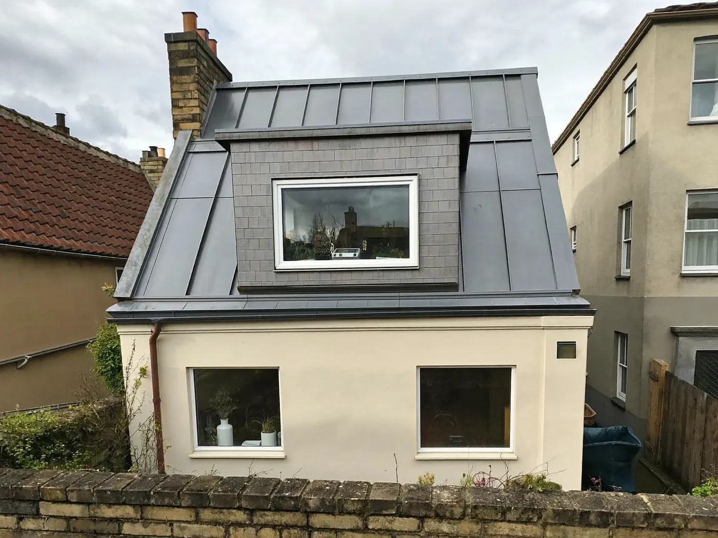 High Wycombe: grey-clad box dormer loft conversion on the rear roof of a house with white windows