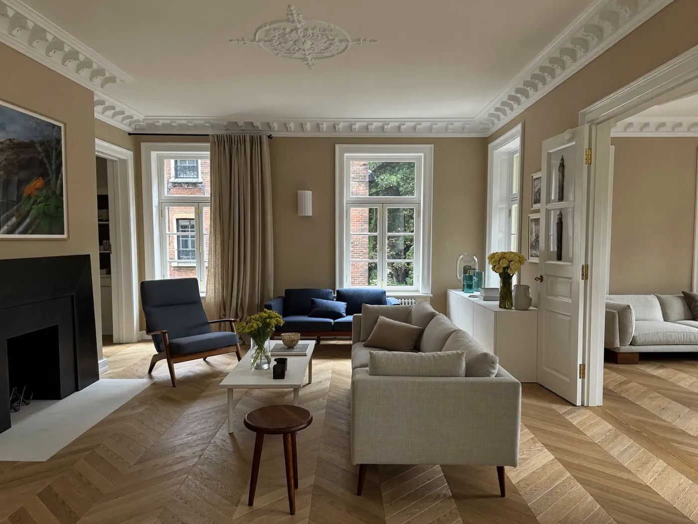 Kensington & Chelsea: renovated living room with painted walls and wooden flooring