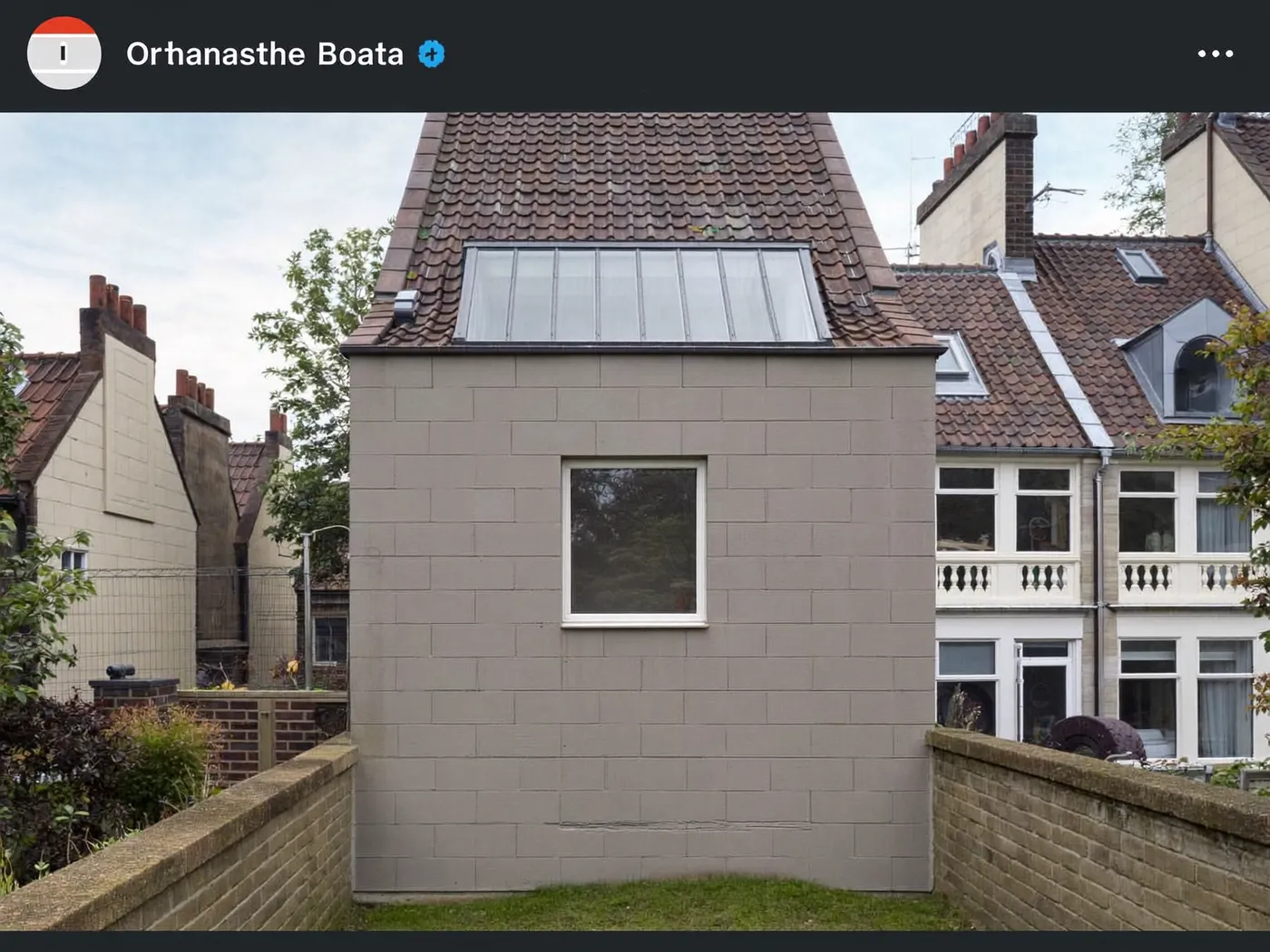 Lambeth: grey-clad box dormer loft conversion on the rear roof of a house with white windows