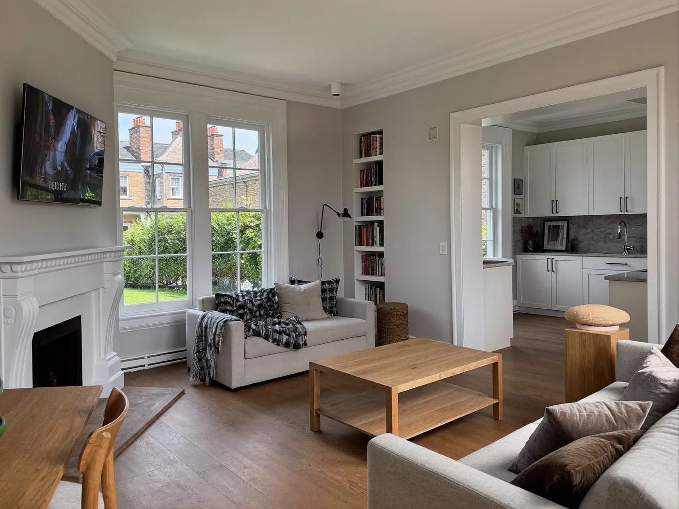 Lambeth: renovated living room with painted walls and wooden flooring