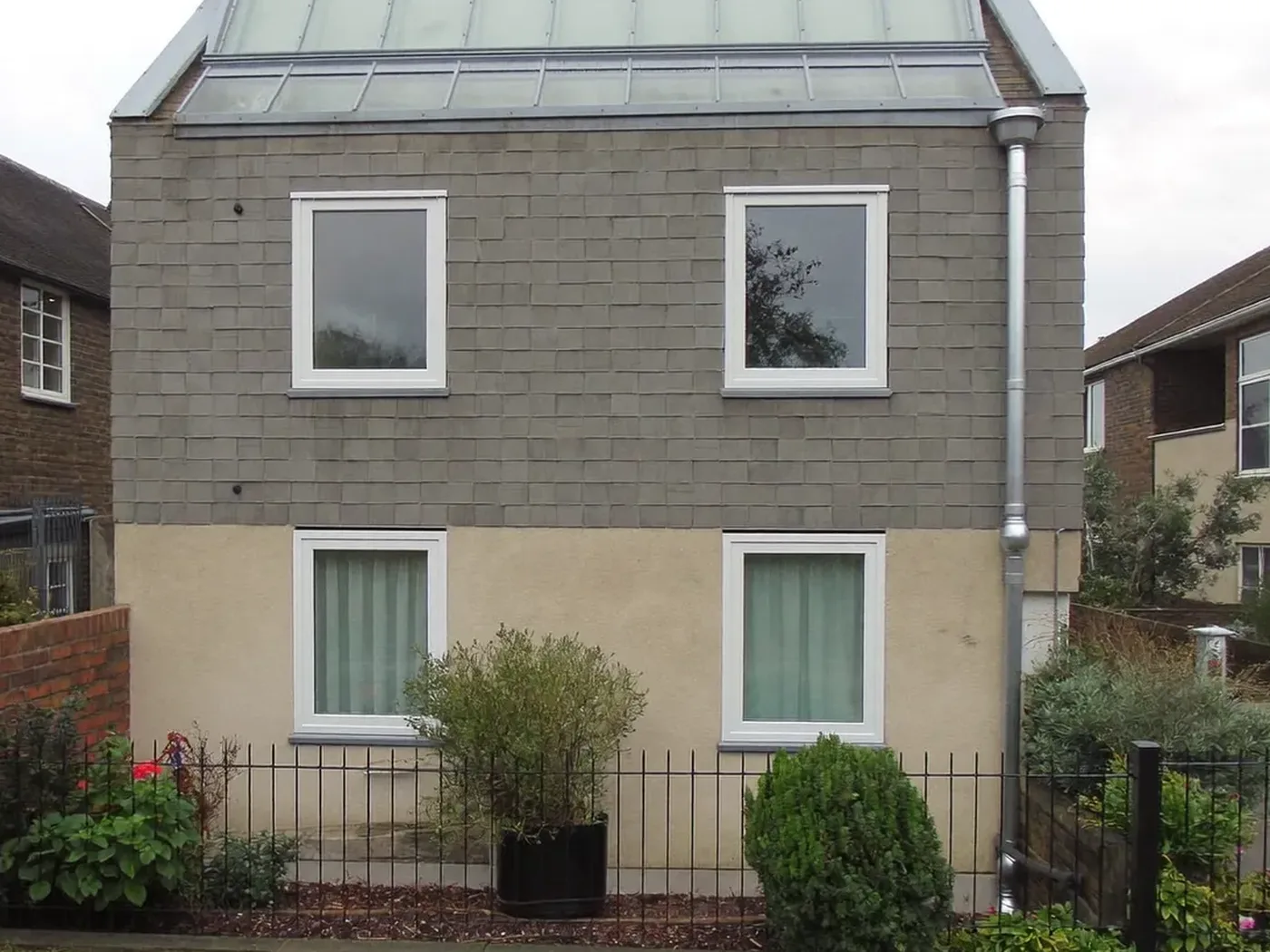 Maidenhead: grey-clad box dormer loft conversion on the rear roof of a house with white windows