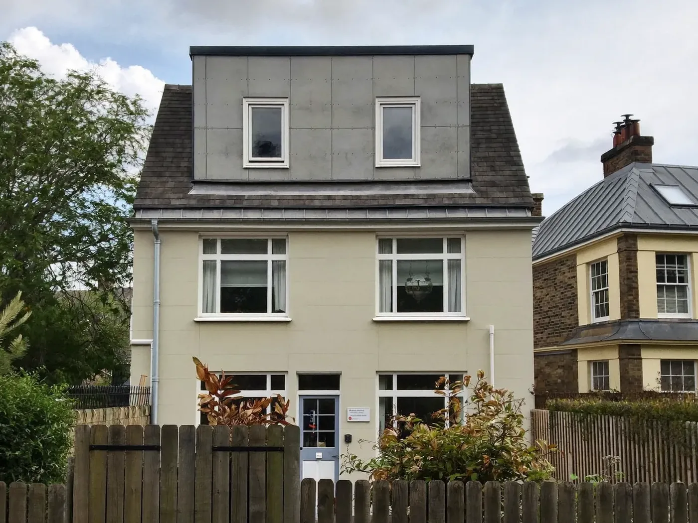 Slough: grey-clad box dormer loft conversion on the rear roof of a house with white windows