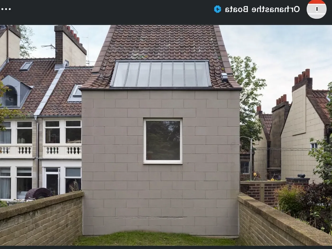 Staines-upon-Thames: grey-clad box dormer loft conversion on the rear roof of a house with white windows