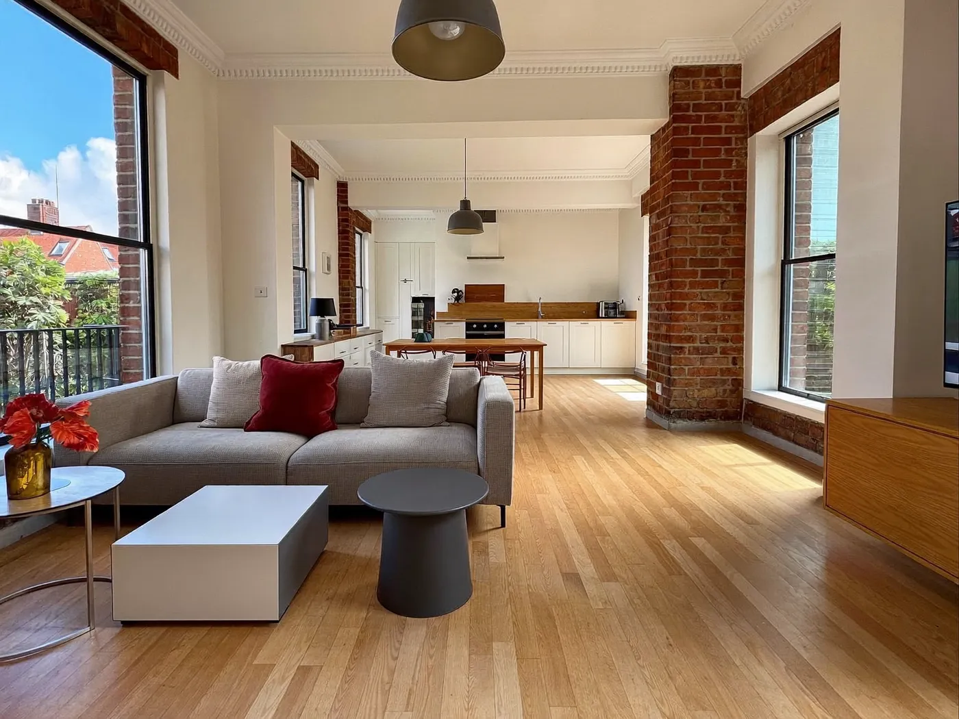 Tower Hamlets: renovated living room with painted walls and wooden flooring