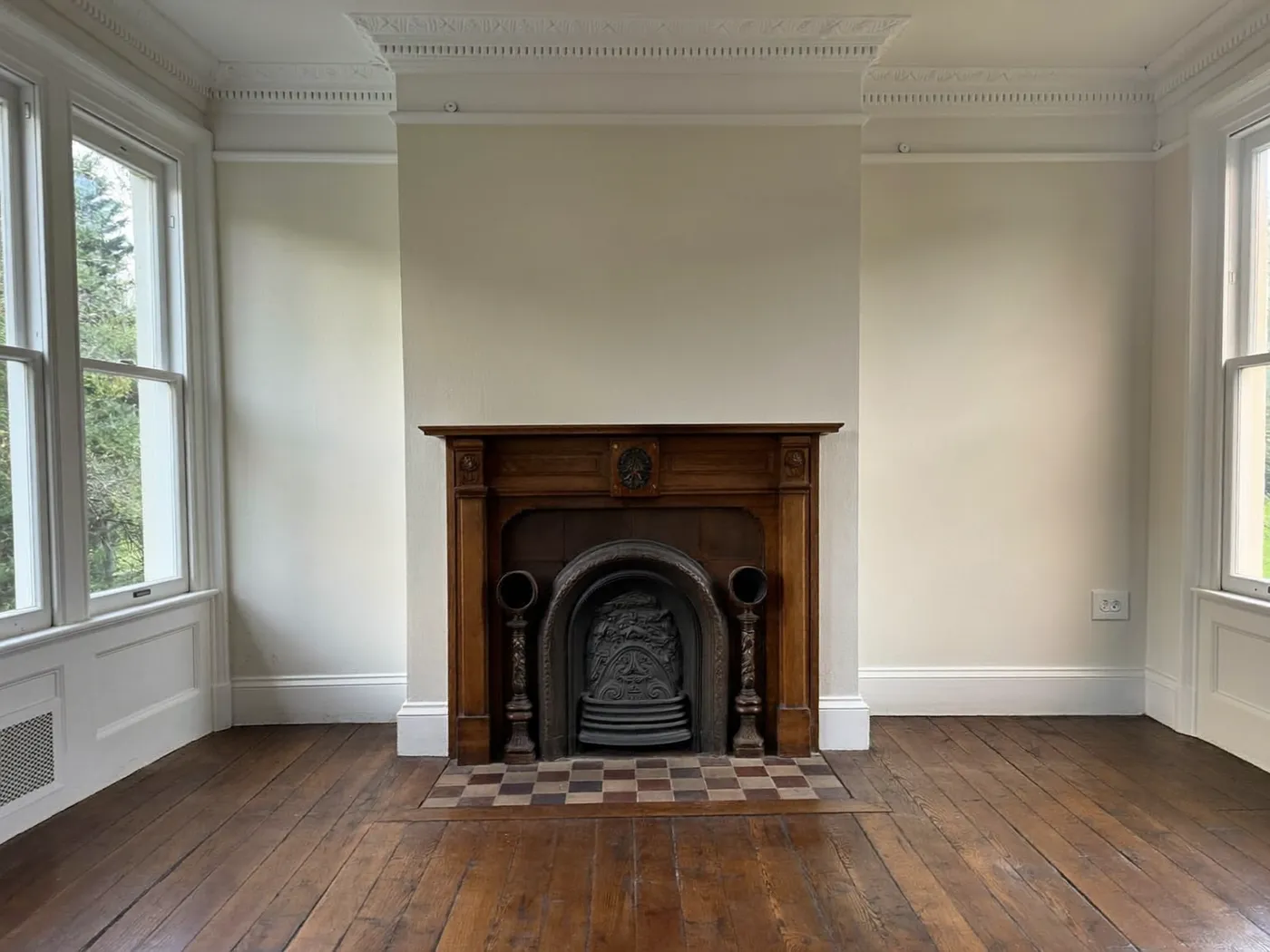 Tower Hamlets: restored Victorian reception room with a fireplace, cornicing and sash windows
