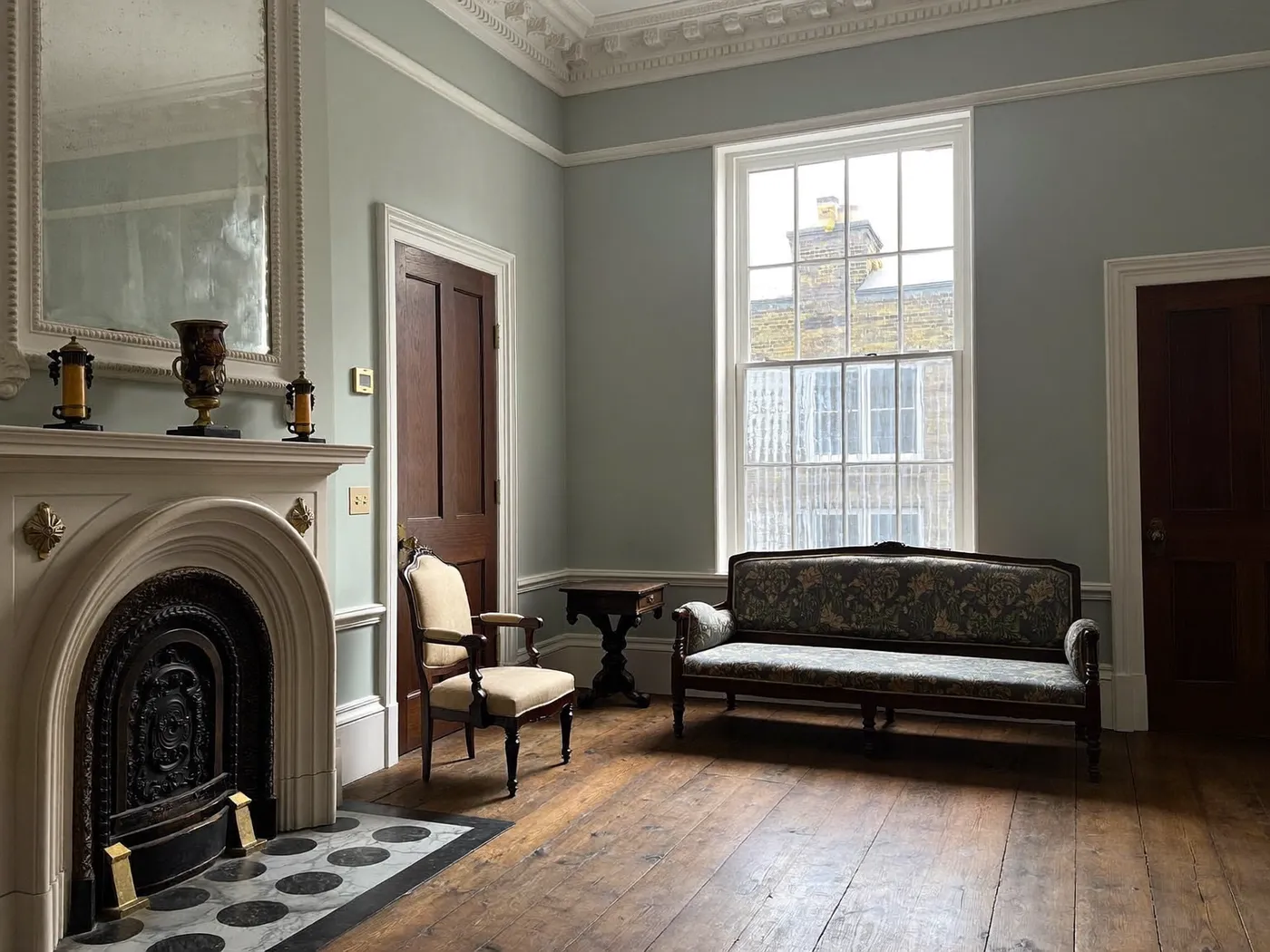 Westminster: restored Victorian reception room with a fireplace, cornicing and sash windows