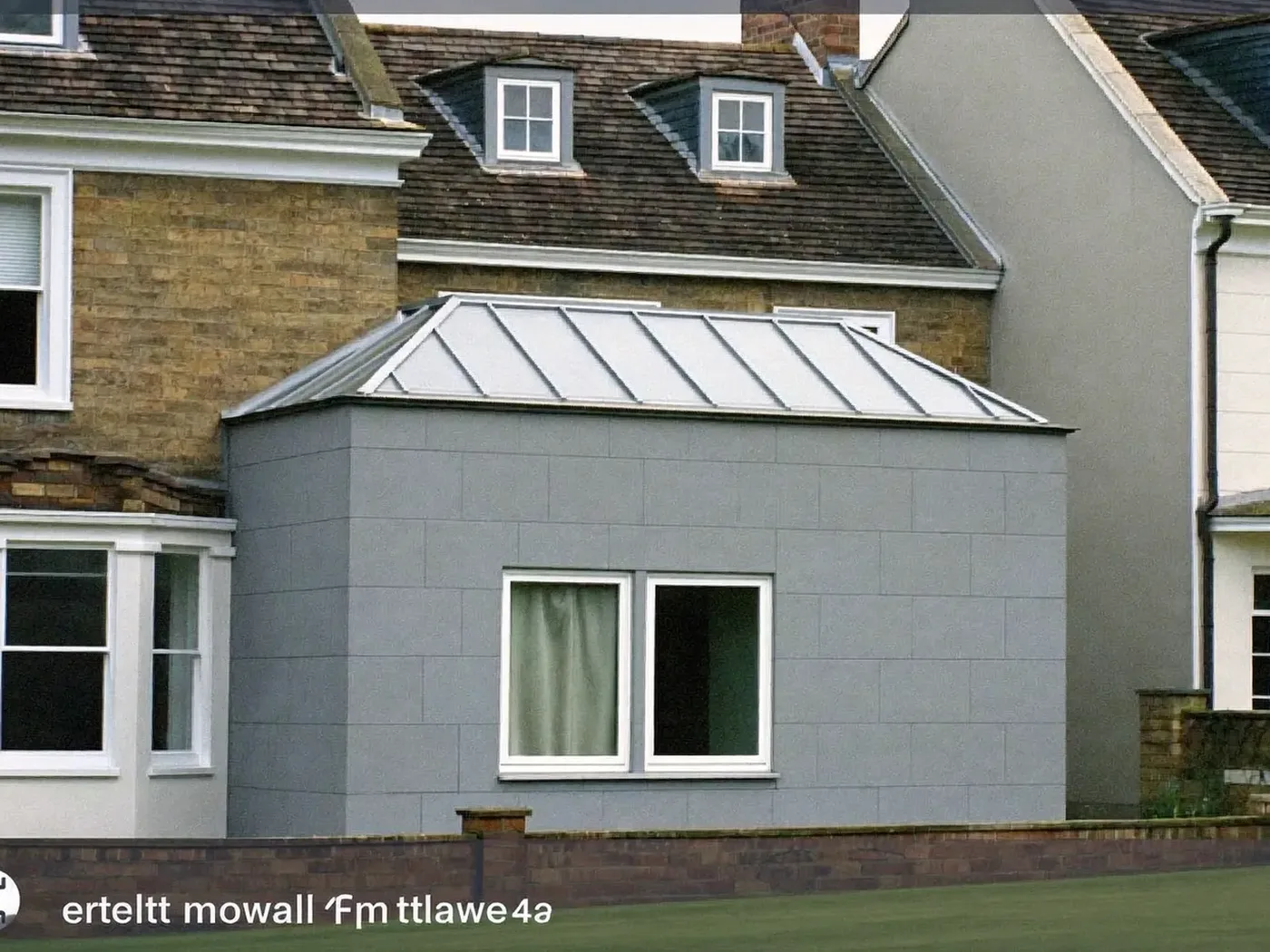 Windsor: grey-clad box dormer loft conversion on the rear roof of a house with white windows